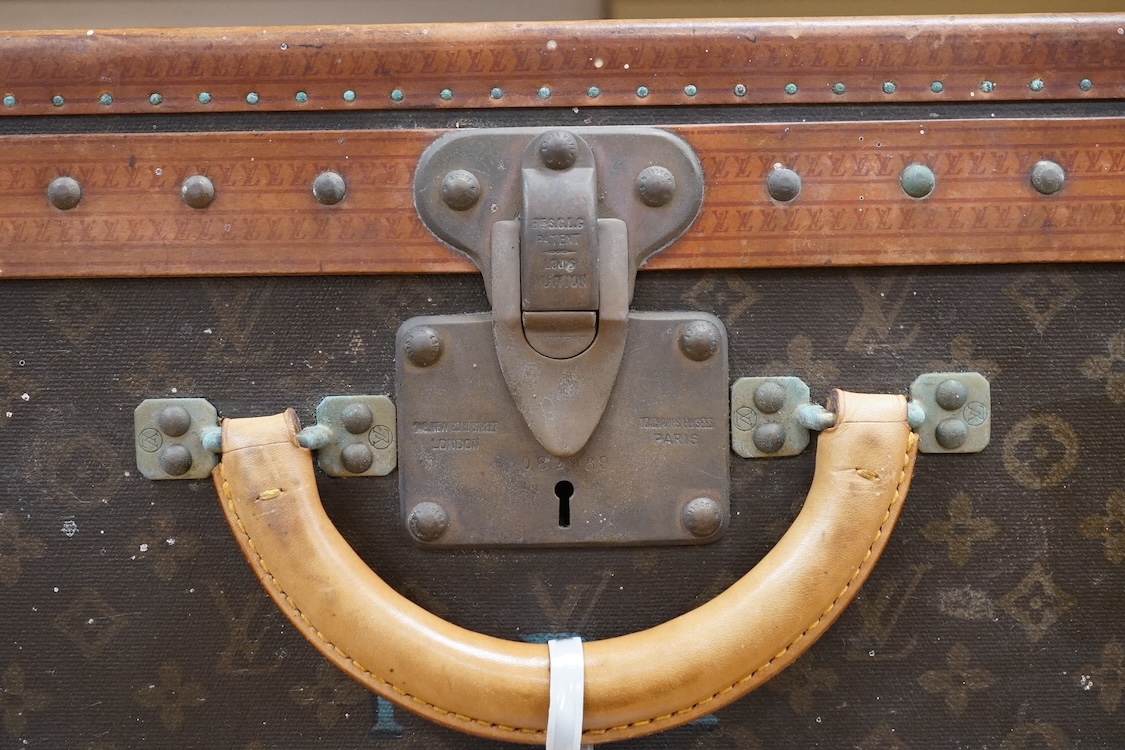 A vintage Louis Vuitton monogram suitcase with two original keys, numbered 793692 to the linen covered interior, height 22cm, width 76cm, depth 46cm